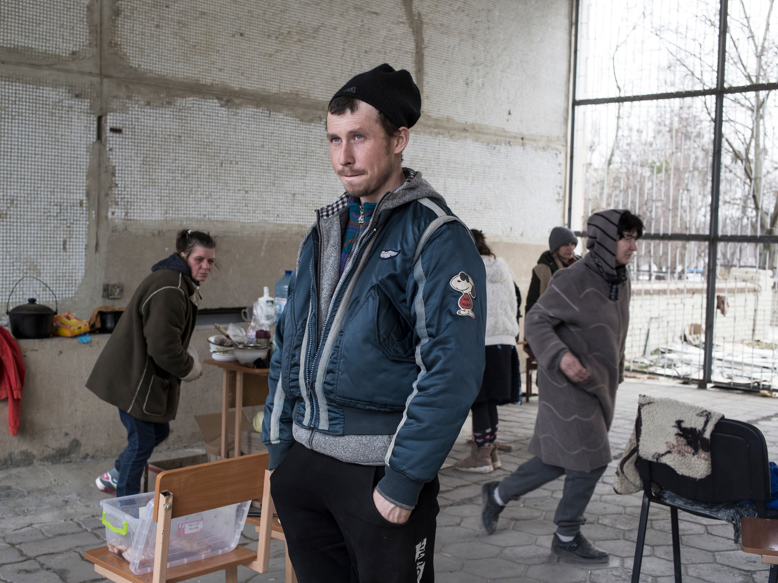 Front line district of Saltivka, a northeastern suburb of Kharkiv, damaged by periodic shelling from Russia army. About thirty residents found shelter in the basement of a damaged schools. The basement has not electricity and cooking is made outside over