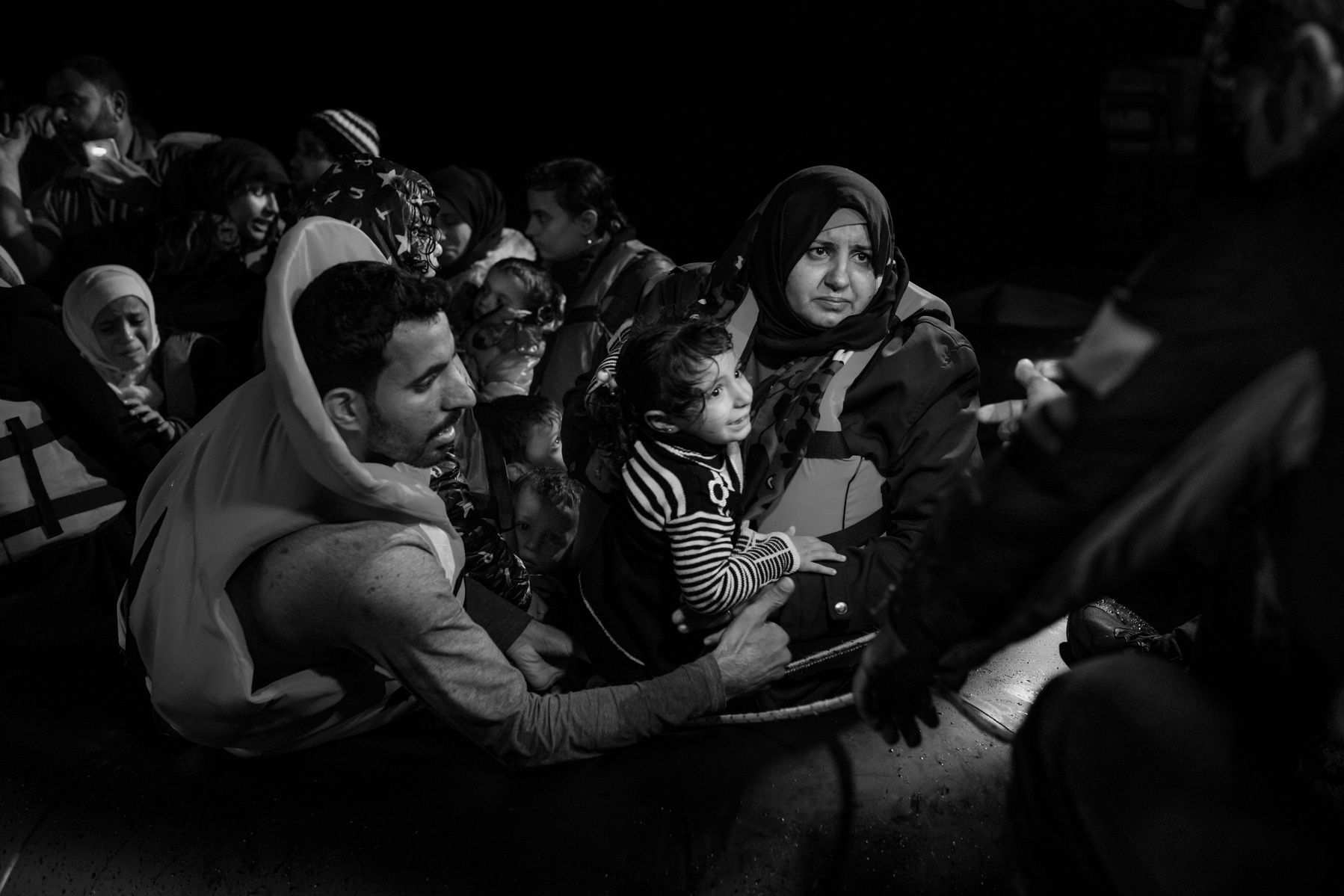 An inflatable boat overcrowded with Syrian refugees had it's engine failure during the night trip from Turkish coast, but was safely spotted and towed to Skala Sikaminias port by a Greek fishing boat, Lesbos, Greece on 12 November, 2015. At the port, ref