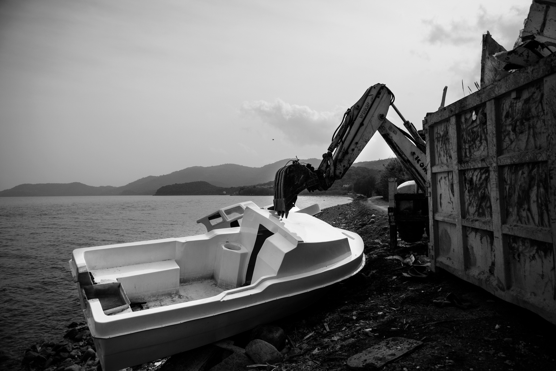 Flimsy fiberglass boats used by refugees crossing the sea from Turkey are removed from the shores of Lesbos near Skala Sikaminias, Greece on 02 March, 2016. Lesbos, the Greek vacation island in the Aegean Sea between Turkey and Greece, faces massive refug