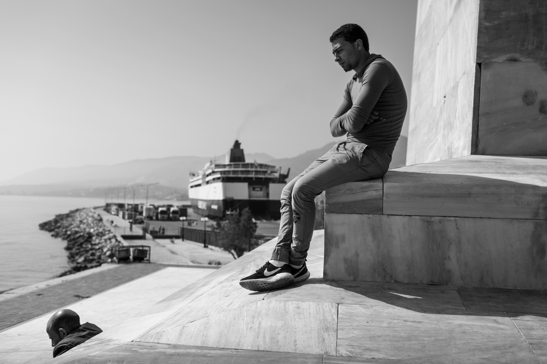 As deportation of some refugees has began few days earlier, this Egyptian man wait with growing anguish about his faith near Mytilene port, on 07 April, 2016. Lesbos, the Greek vacation island in the Aegean Sea between Turkey and Greece, received massive