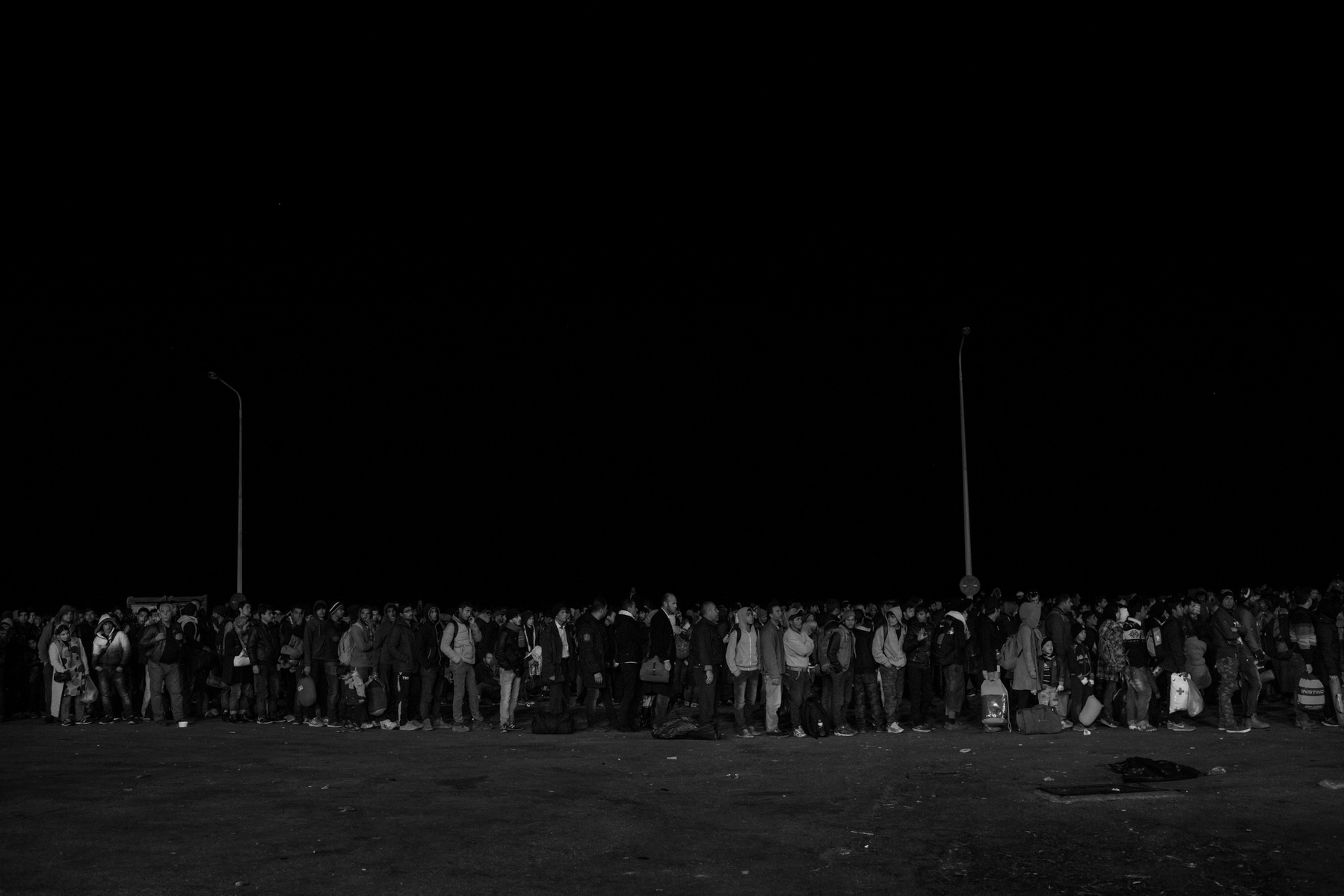 Refugees wait for boarding ferry boats to Athen at Mytilini port. Refugees from Afghanistan and Syria arrive in boats on the shores of Lesbos near Skala Sikaminias, Greece on 09
November, 2015. Lesbos, the Greek vacation island in the Aegean Sea between T