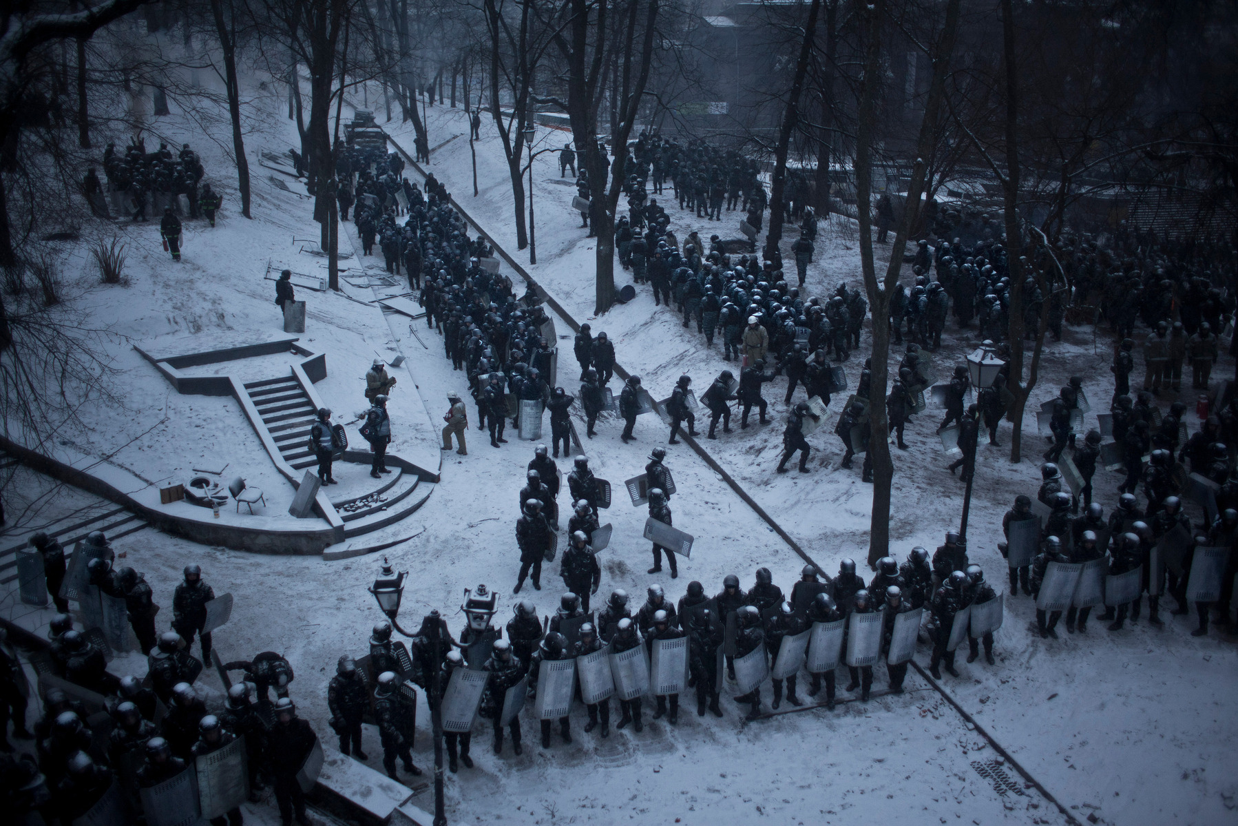 Riot police line up during face off with anti government protesters manning barricades on Hrushevskoho street in Kiev, 21 January 2014.