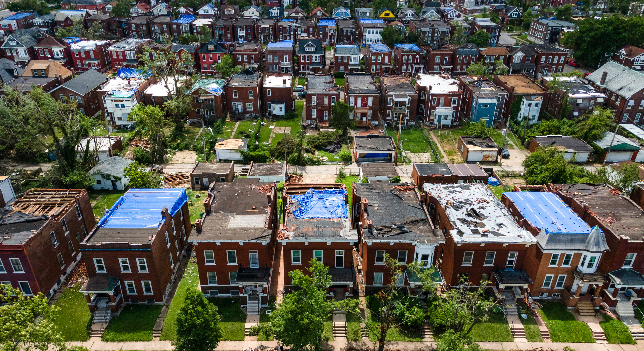 Roofs are covered with tarps after damage caused by the May 16 tornado in the O'Fallon neighborhood of St. Louis on Tuesday, May 20, 2025.