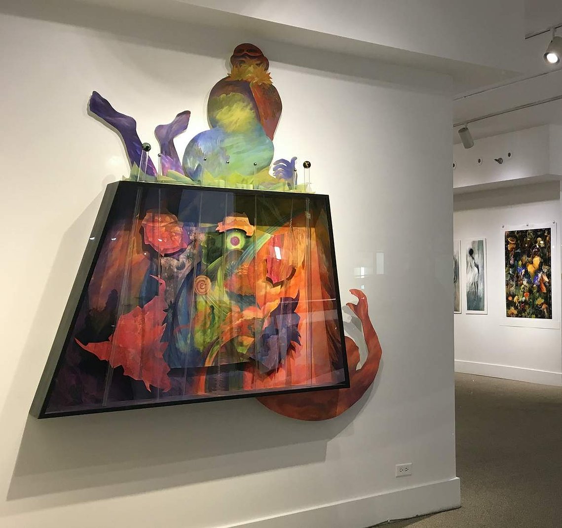 Mixed media artwork on a gallery wall.