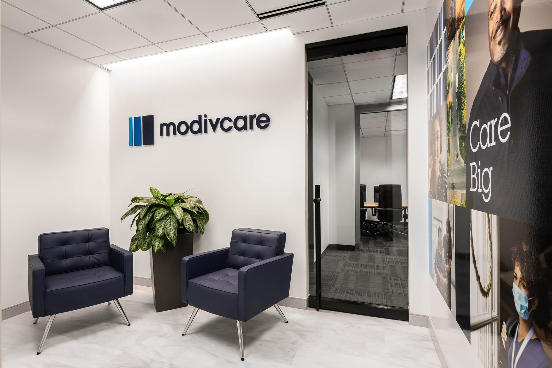 Architectural photography showing Modivcare lobby entrance with signage. Architect for project is Focus Studio.  Photography by St. Louis Architectural Photographer Karen Palmer.