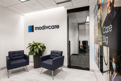 Architectural photography showing Modivcare lobby entrance with signage. Architect for project is Focus Studio.  Photography by St. Louis Architectural Photographer Karen Palmer.