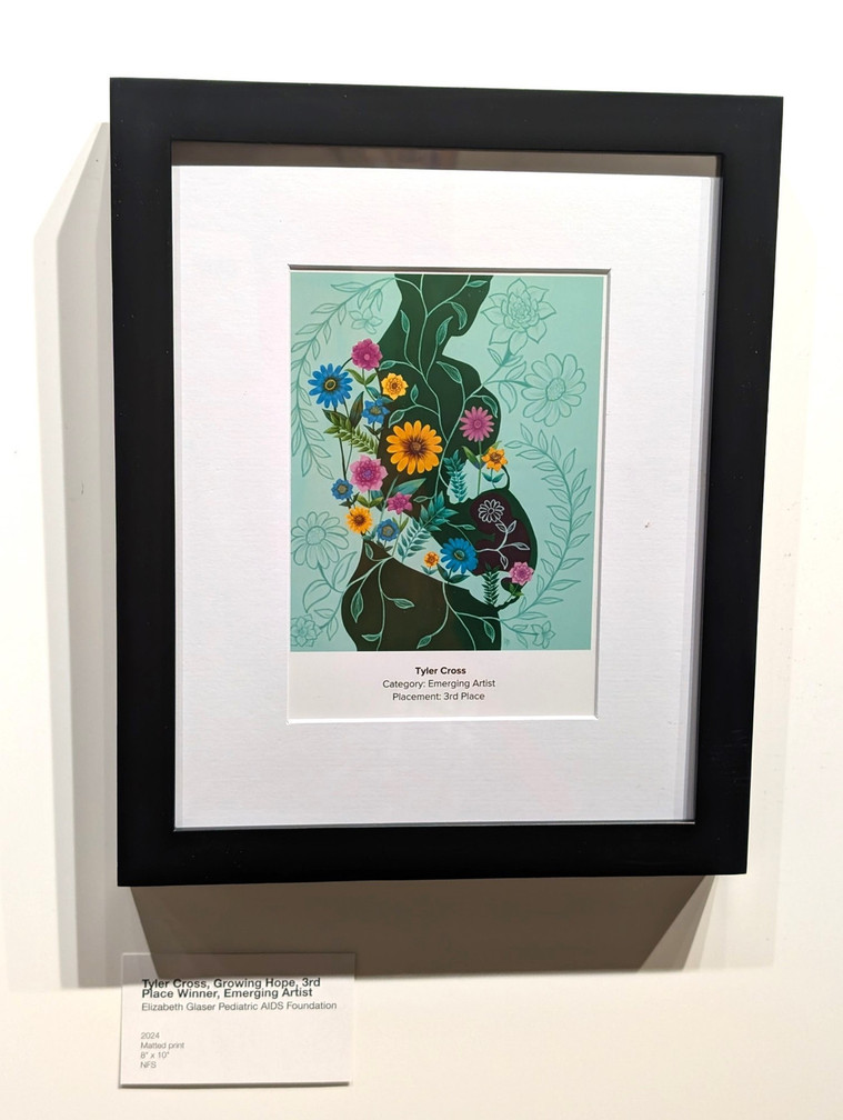 Framed illustration of a green silhouette of a pregnant woman holding her belly. Several colorful flowers are sprouting from her.