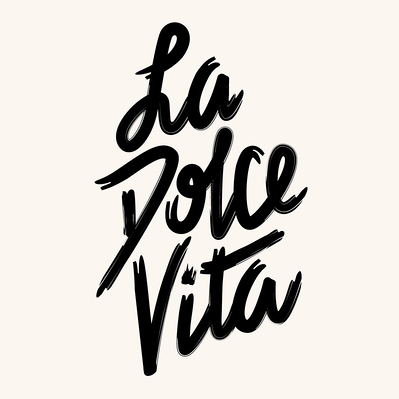 Black and white hand drawn lettering of the phrase "La Dolce Vita" in black and white brush script.