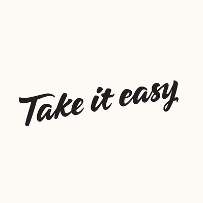 "Take it easy" hand lettered in black and white script.