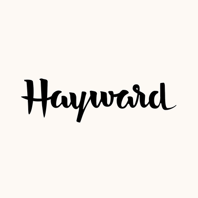 Black and white hand drawn lettering of the word "Hayward" in black and white brush script.