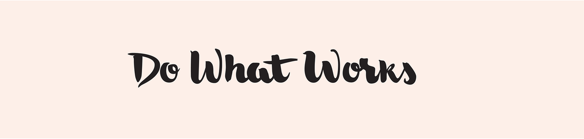 The phrase “Do What Works” hand lettered with a brush in black ink in a heavy upright script, on a pale peach background.