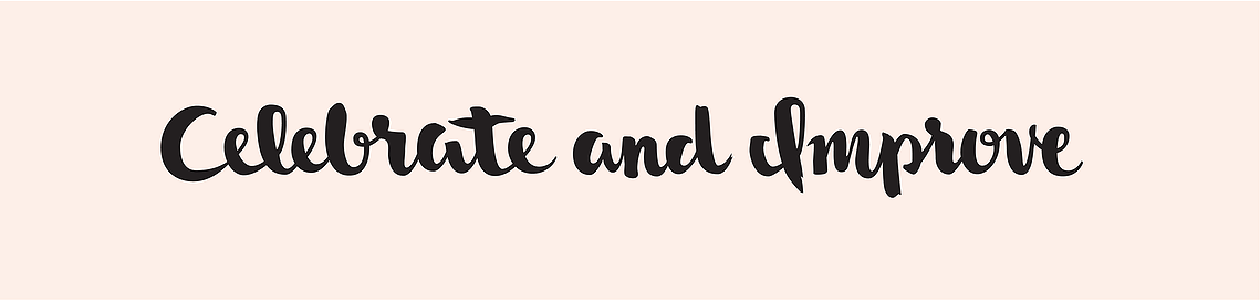 The phrase “Celebrate and Improve” hand lettered with a brush in black ink in a heavy upright script, on a pale peach background.