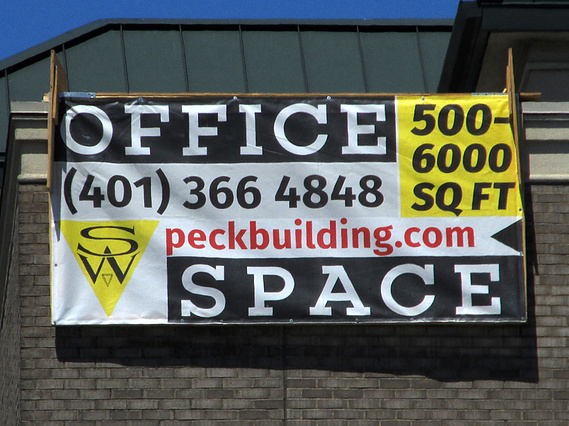 huge vinyl sign advertising office space for Shilshole West in Ballard, Seattle.