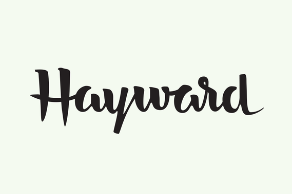 The city name “Hayward” hand lettered with a brush in black ink in a heavy upright script.