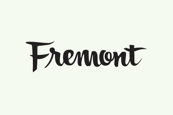 The city name “Fremont” hand lettered with a brush in black ink in a heavy upright script.
