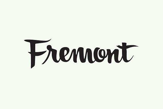 The city name “Fremont” hand lettered with a brush in black ink in a heavy upright script.