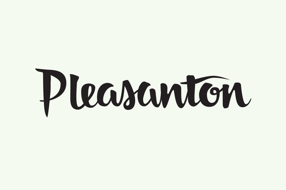 The city name “Pleasanton” hand lettered with a brush in black ink in a heavy upright script.