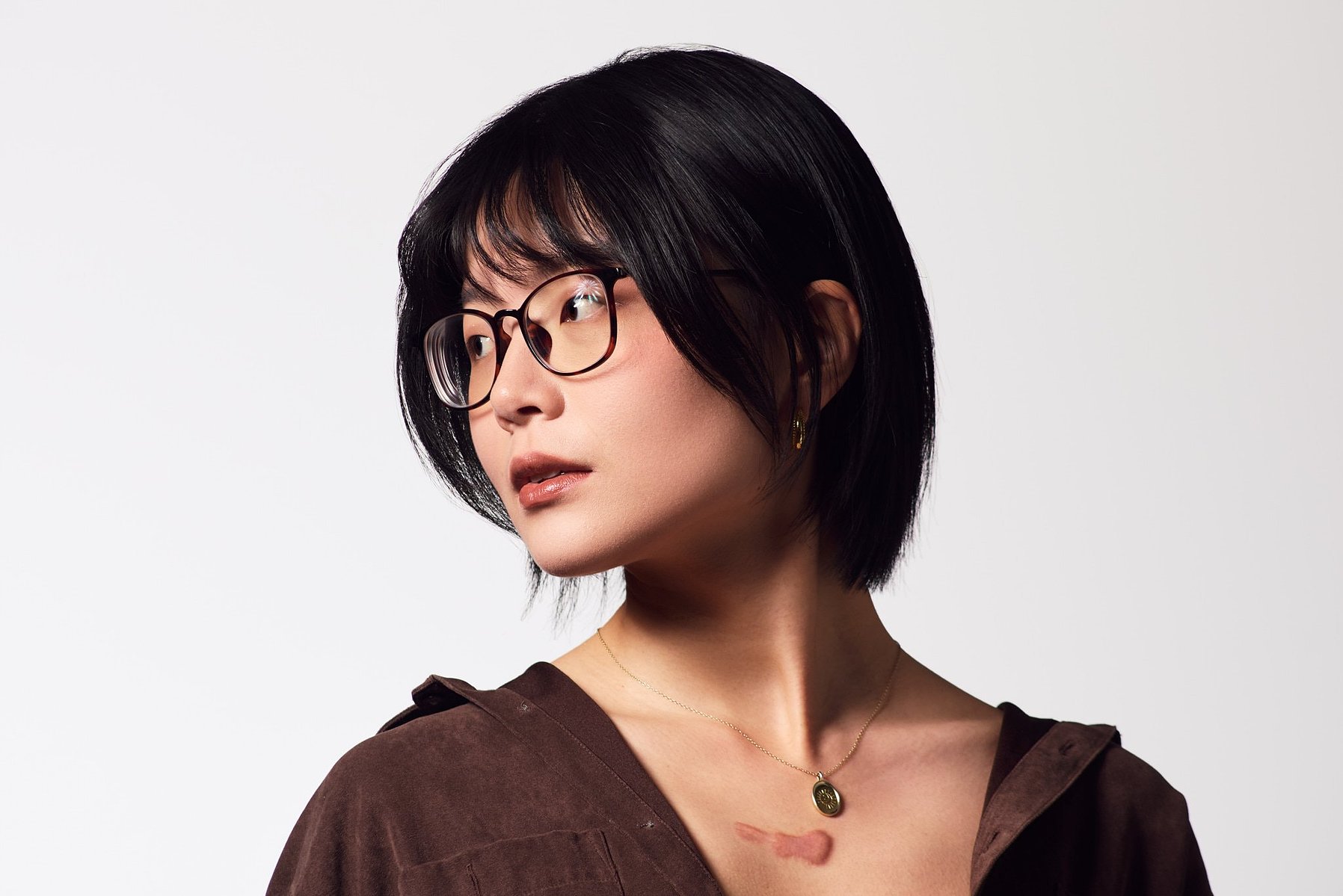 A studio portrait of illustrator and translator Xieyu.