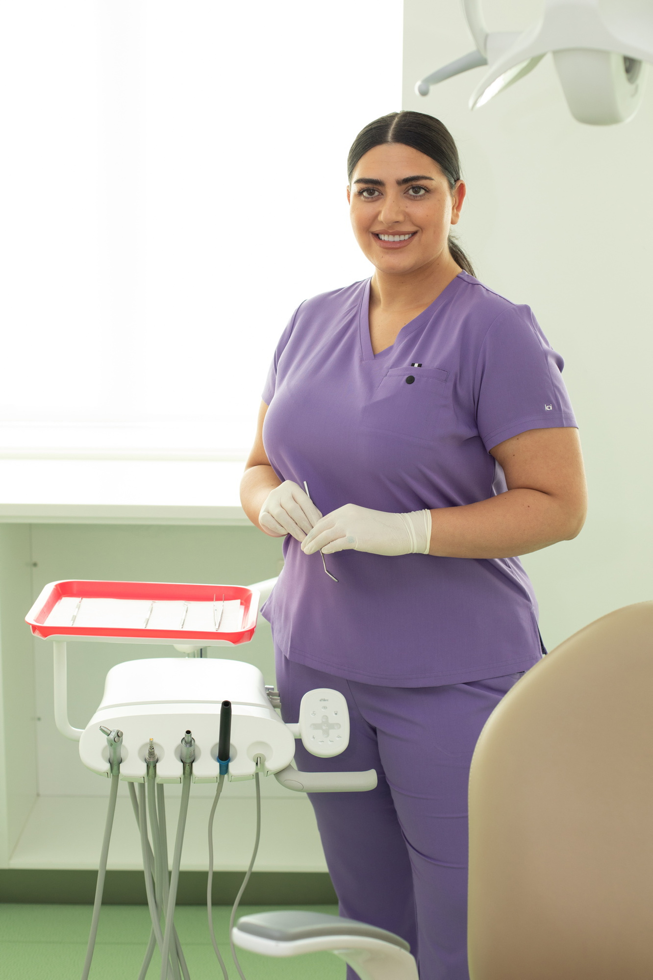 Happythreads Commercial Clothing Brand for Healthcare Professionals.  Lifestyle Photoshoot model wears purple scrubs. Professional photographer Dublin 