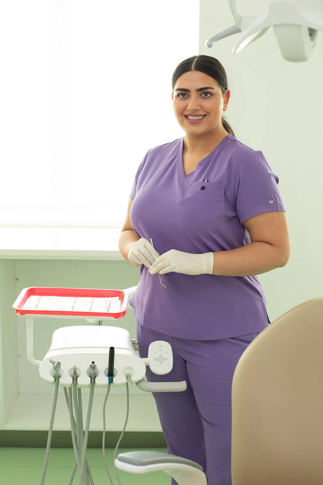Happythreads Commercial Clothing Brand for Healthcare Professionals.  Lifestyle Photoshoot model wears purple scrubs. Professional photographer Dublin 