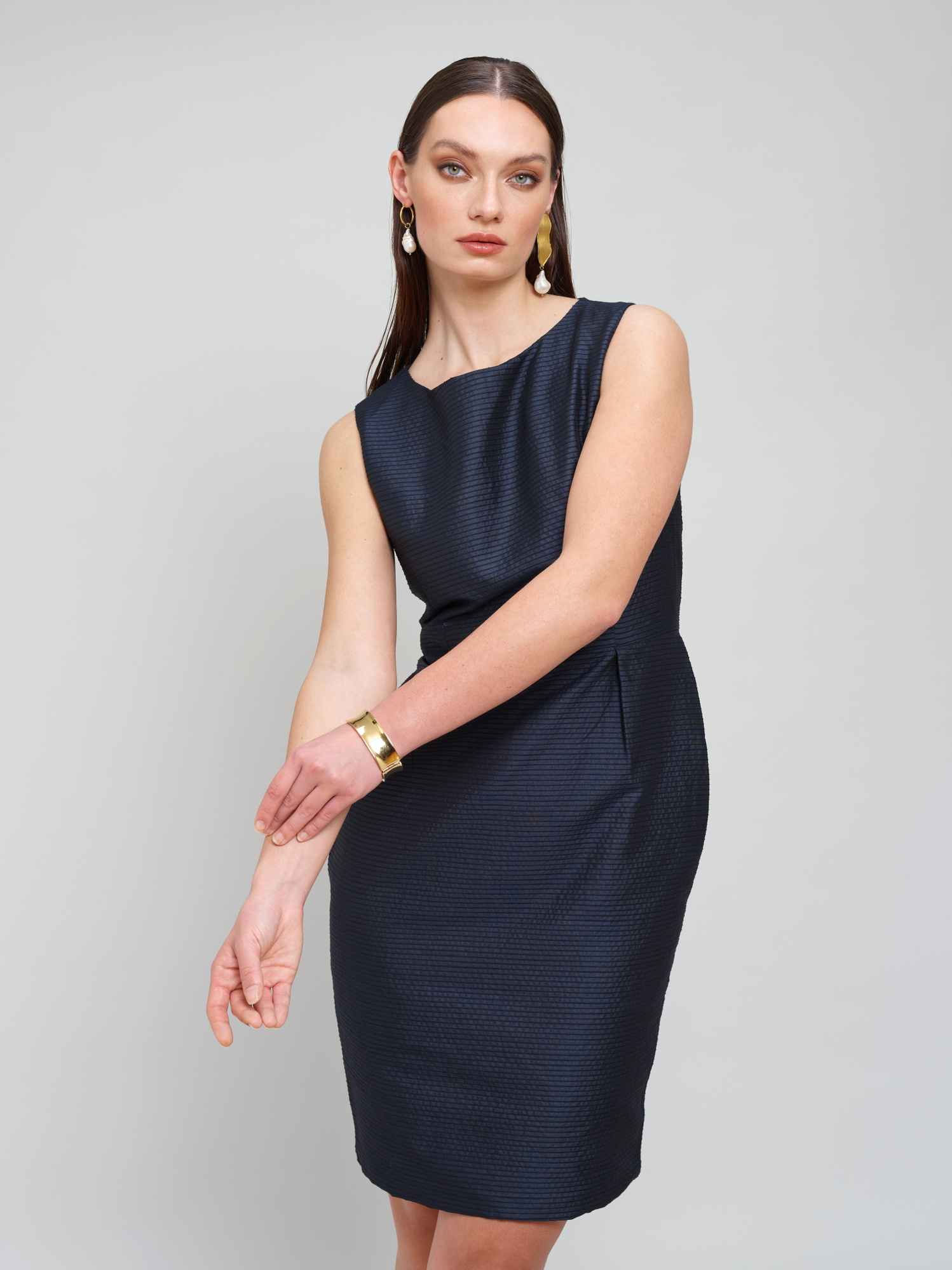 Model wears a navy dress for Amilli Clothing Studio Fashion shoot Spring/Summer 2023 collection in a professional commercial photography studio in Dublin