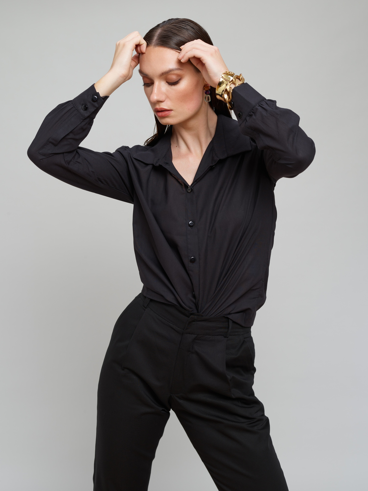 Model wears a black suit for Amilli Clothing Studio Fashion shoot Spring/Summer 2023 collection in a professional commercial photography studio in Dublin