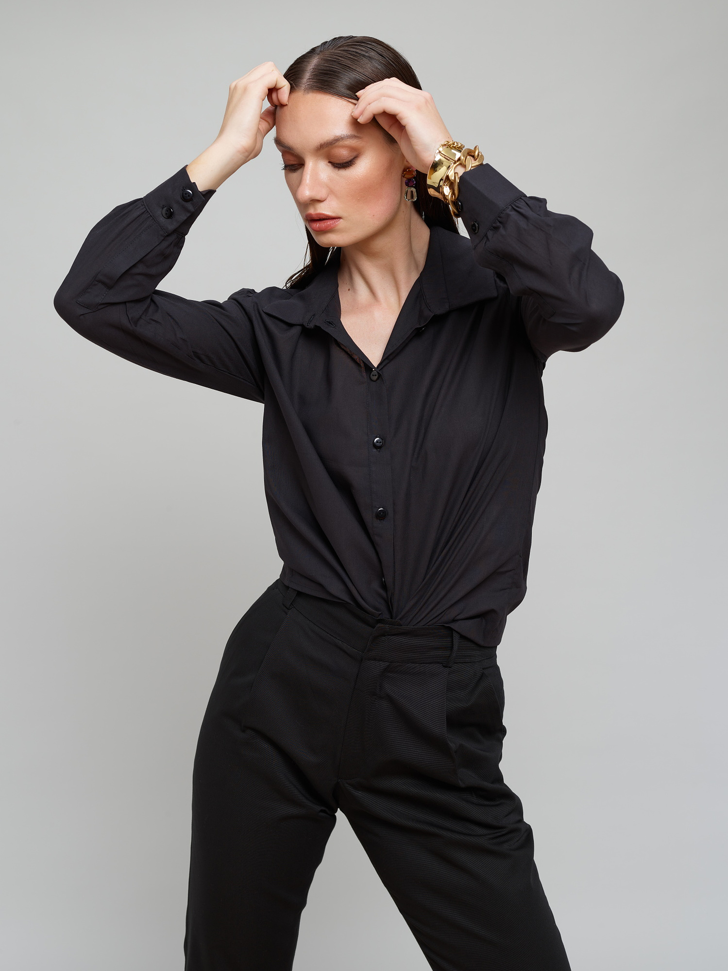 Model wears a black suit for Amilli Clothing Studio Fashion shoot Spring/Summer 2023 collection in a professional commercial photography studio in Dublin