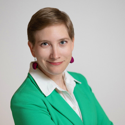 A Corporate headshot of a smiling white woman with blonde pixie cut hair, wearing round earrings with black stripes, a bright green blazer, and a white collar top at the Astho Conference 2023 in Crystal City, Virginia.
http://www.annanproductions.com/