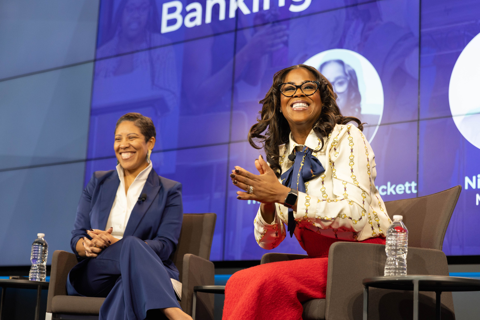 Thasunda Brown Duckett , President and Chief Executive Officer of TIAA wearing a red skirt, speaking at a panel at the 2024 Saddie Collective Conference at the Urban Institute in Washington, D.C.