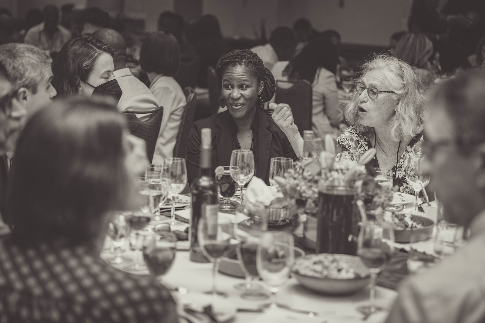 5th Haiti Funders Conference 2023.
Women gathered at a table eating, drinking, and smiling at the 5th Haiti Funders Conference in Washington D.C. www.annanproductions.com
