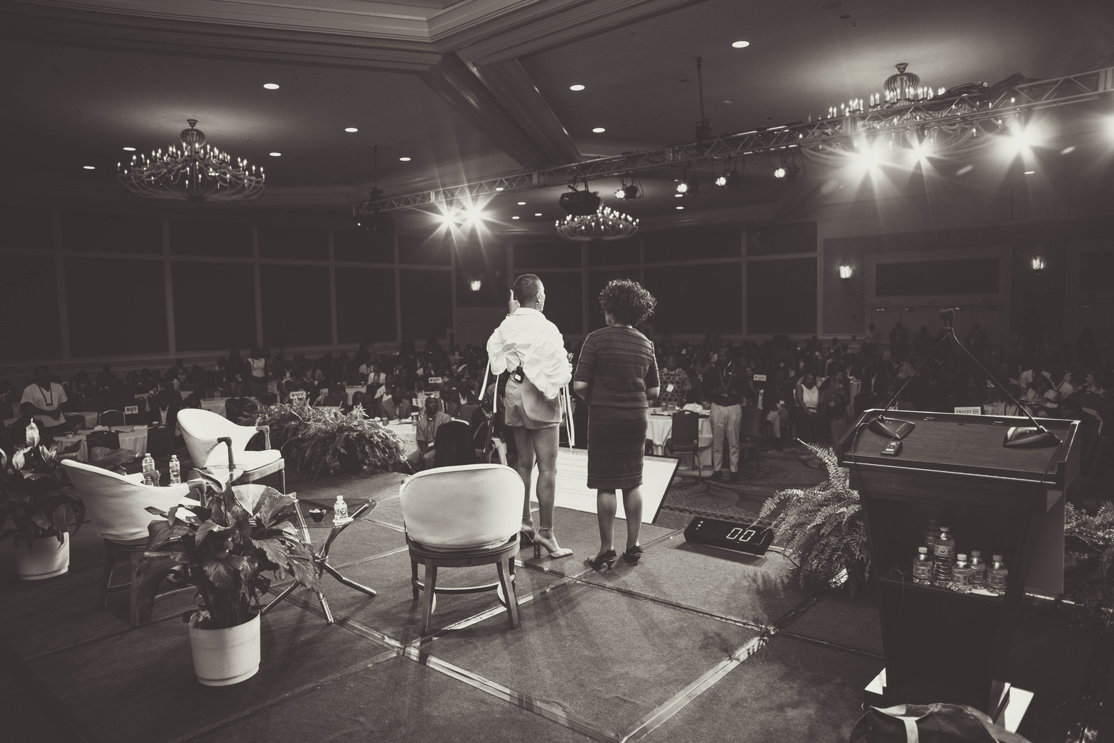 A black and white photograph of two black women on a stage, overlooking the audience, hosting the 16th Annual Conference of African American Financial Professionals - CAAFP Event 2022
https://www.annanproductions.com/