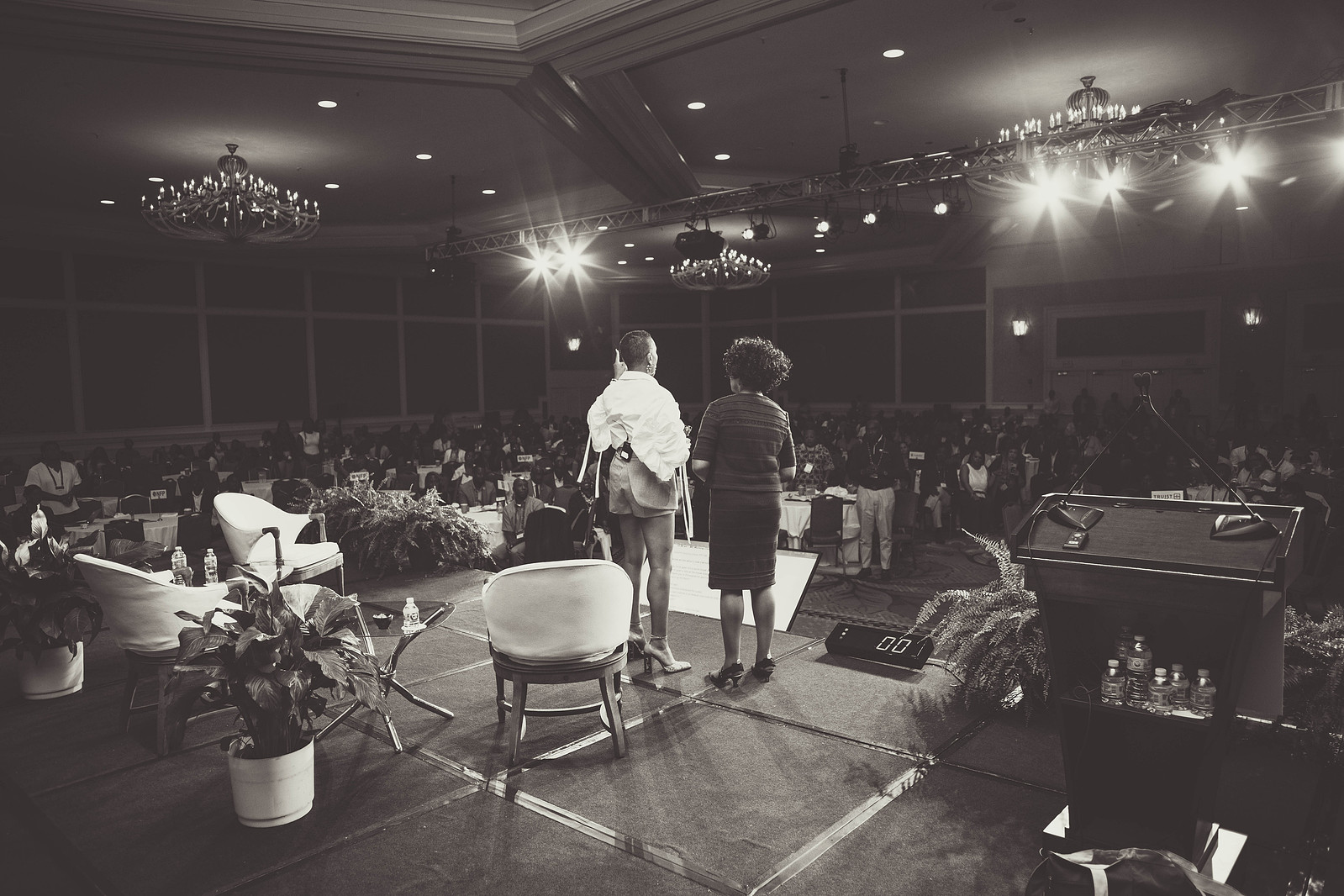 A black and white photograph of two black women on a stage, overlooking the audience, hosting the 16th Annual Conference of African American Financial Professionals - CAAFP Event 2022
https://www.annanproductions.com/