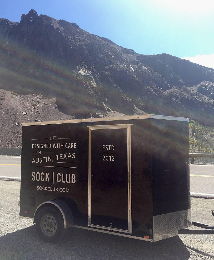 Typography design on branded trailer for sock subscription company