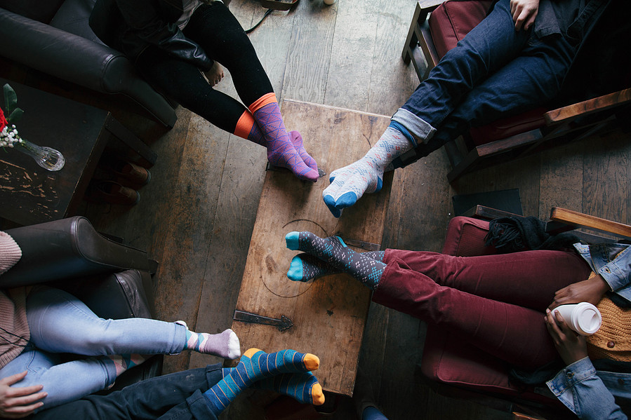 Custom sock designs modeled on friends at coffee shop