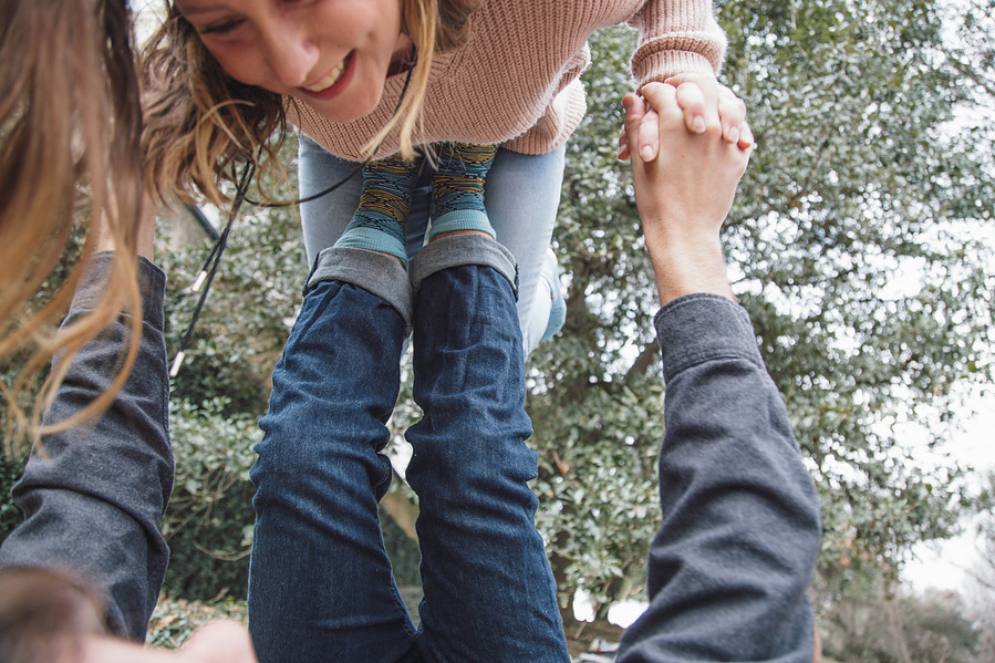 Custom sock designs modeled on couple in park