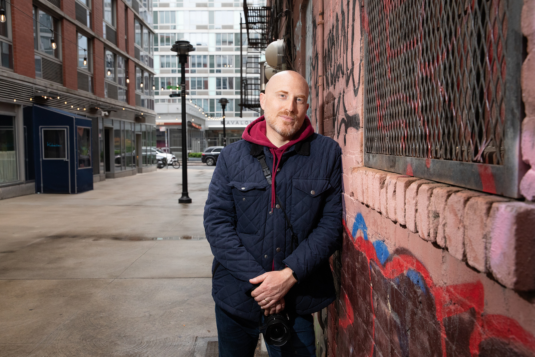 Steve Birnbaum poses in an alleyway where the Ramones' "Rocket to Russia" album cover was taken. Mr. Birnbaum recreates album covers at the original NYC Locations for his long-term project, "The Band Was Here." May 16, 2025. The Bowery, New York, NY. (pho