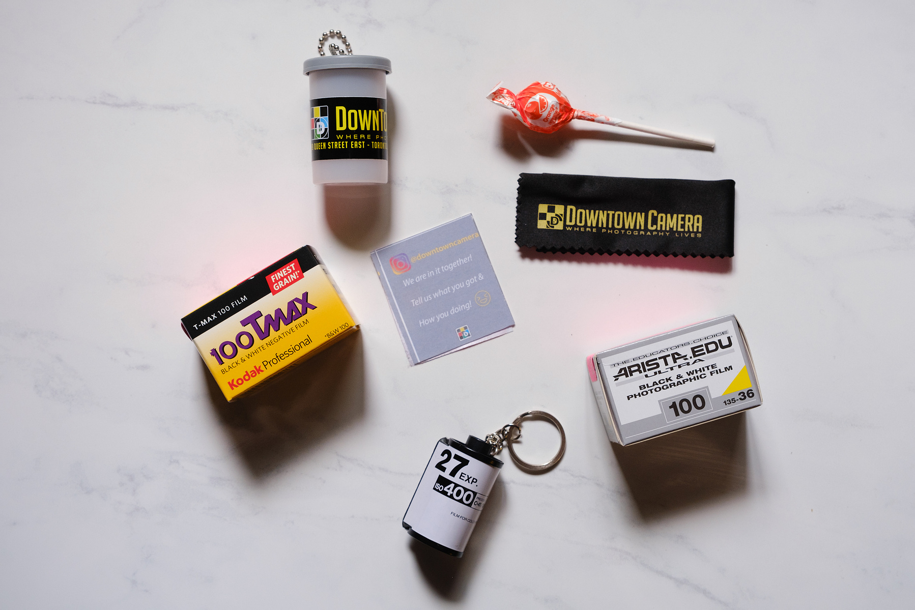 Free film goodies: DTC film holder with cleaning cloth inside || Kodak 100 Tmax || Arista EDU Ultra 100 || Empty film canister keychain