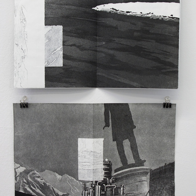 Two open book spreads are clipped up to a white wall. They are black and white, showing illustrations of road surface, distance leaning statues, and construction and manufacturing infrastructure.