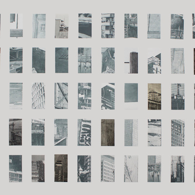 A grid of small glimpses of architectural details like windows, streetlights, concrete surfaces, and doorways, printed in silvery-blue and arranged on a white sheet of paper.