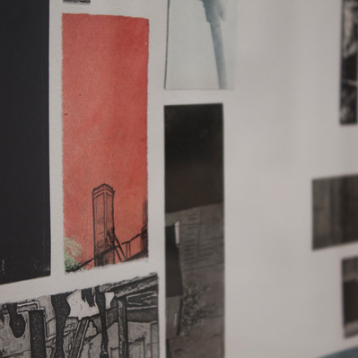 A detail of several rectangular print fragments showing architectural details, fixed to a white sheet of paper.