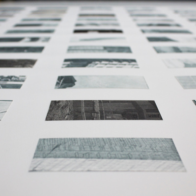 A grid of small glimpses of architectural details like windows, streetlights, concrete surfaces, and doorways, printed in silvery-blue and arranged on a white sheet of paper.