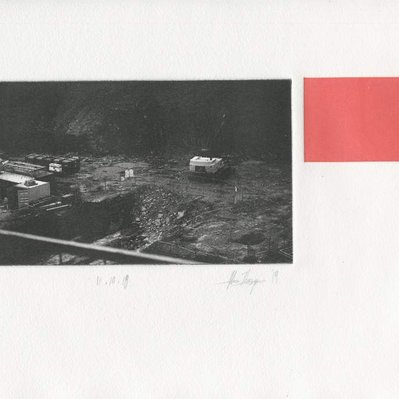 A photographic print of an excavator in a construction site, with a red rectangle next to it.