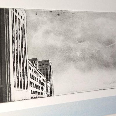 An illustration of a building facade on the extreme left, and a tumultuous cloudy sky. Underneath, there is a bar of blue.