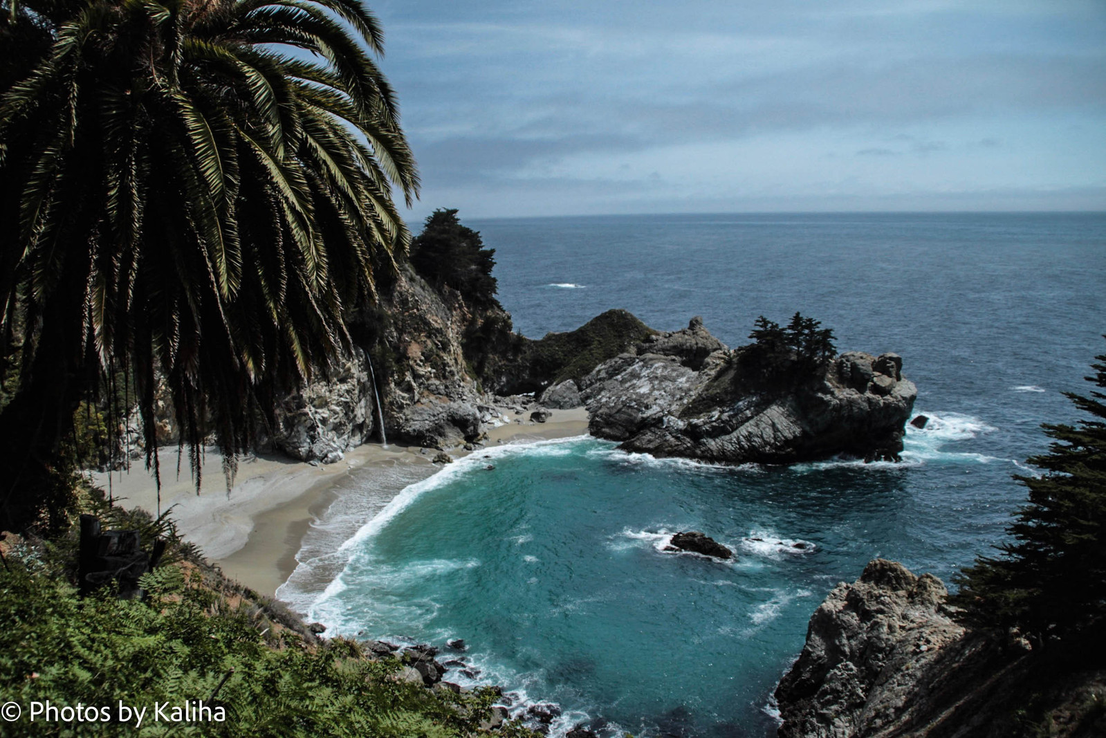 Immerse in the beauty of McWay Falls through this breathtaking photo. Marvel at the enchanting cascade as it meets the Pacific Ocean in Big Sur. Nature's wonder captured in pixels. #McWayFalls #BigSur