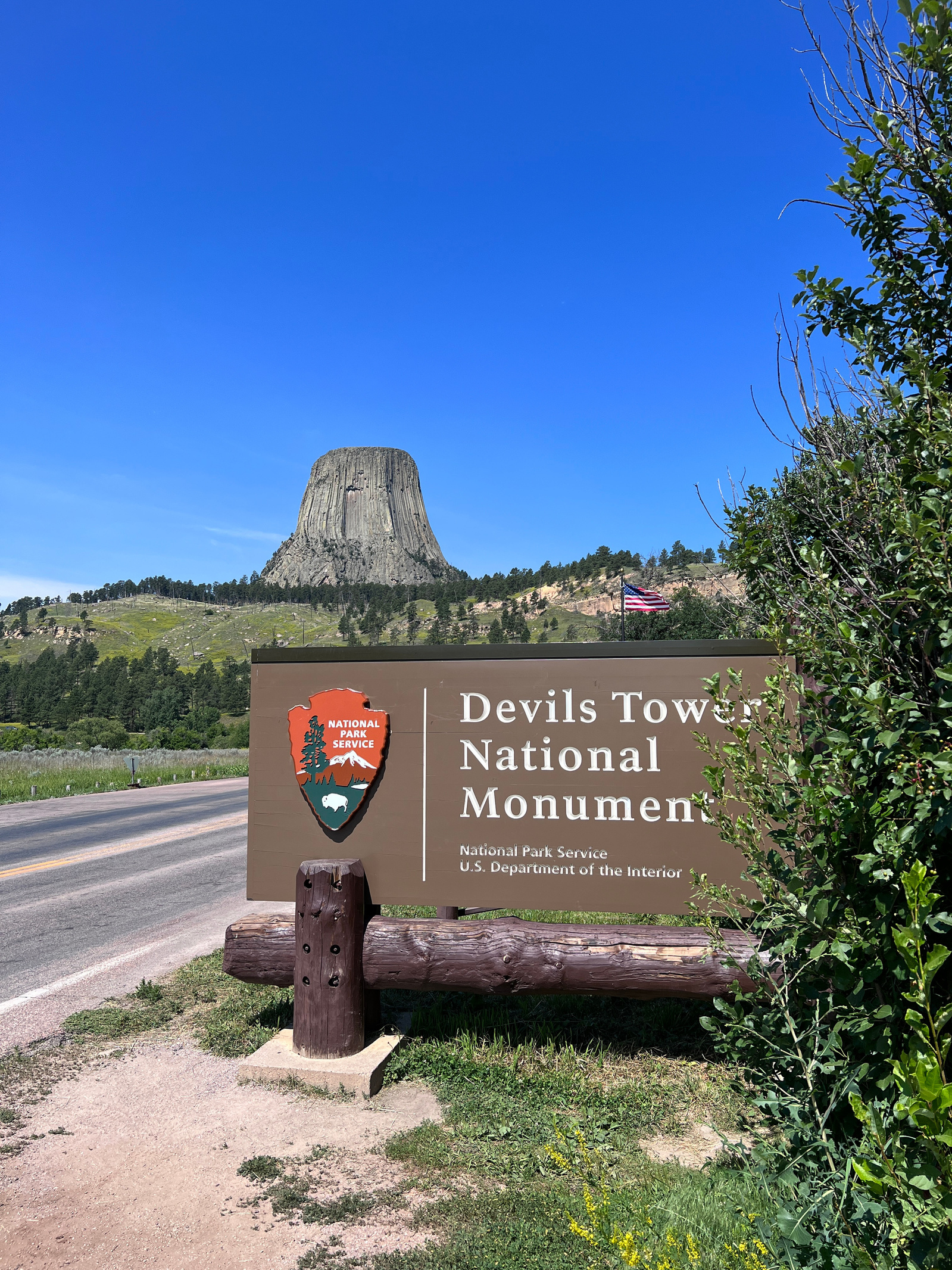 The Devil's Tower Monument gate entrance with monument show in background