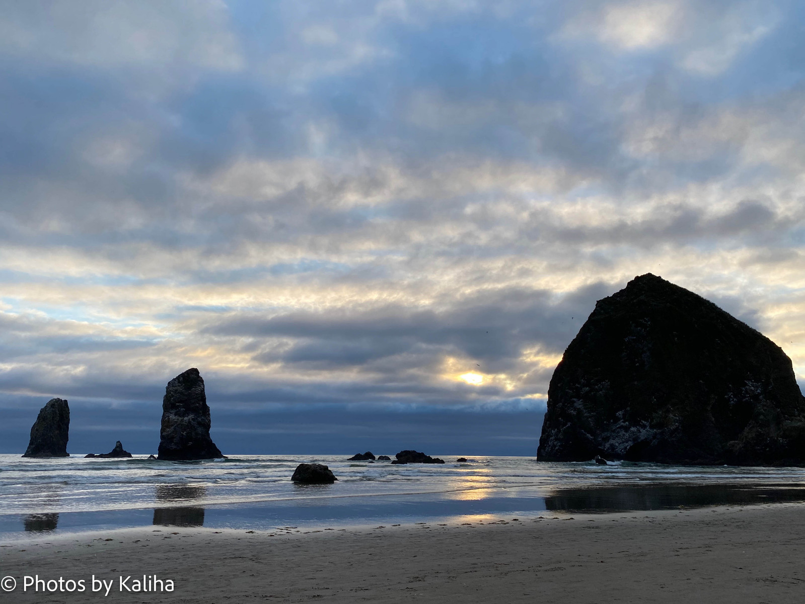 Discover the breathtaking beauty of Haystack Rock in this captivating  photo. Marvel at this majestic sea stack on Oregon Coast, a true natural wonder.
