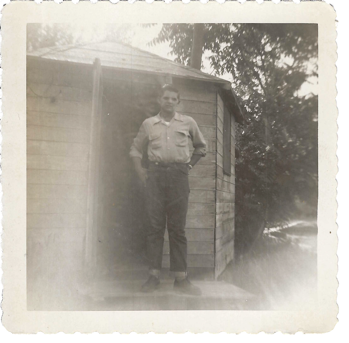 My Grandpa, Gene Swabby, standing on the front step of the shack that he lived in during his time in Washington state as an apple picker. 
