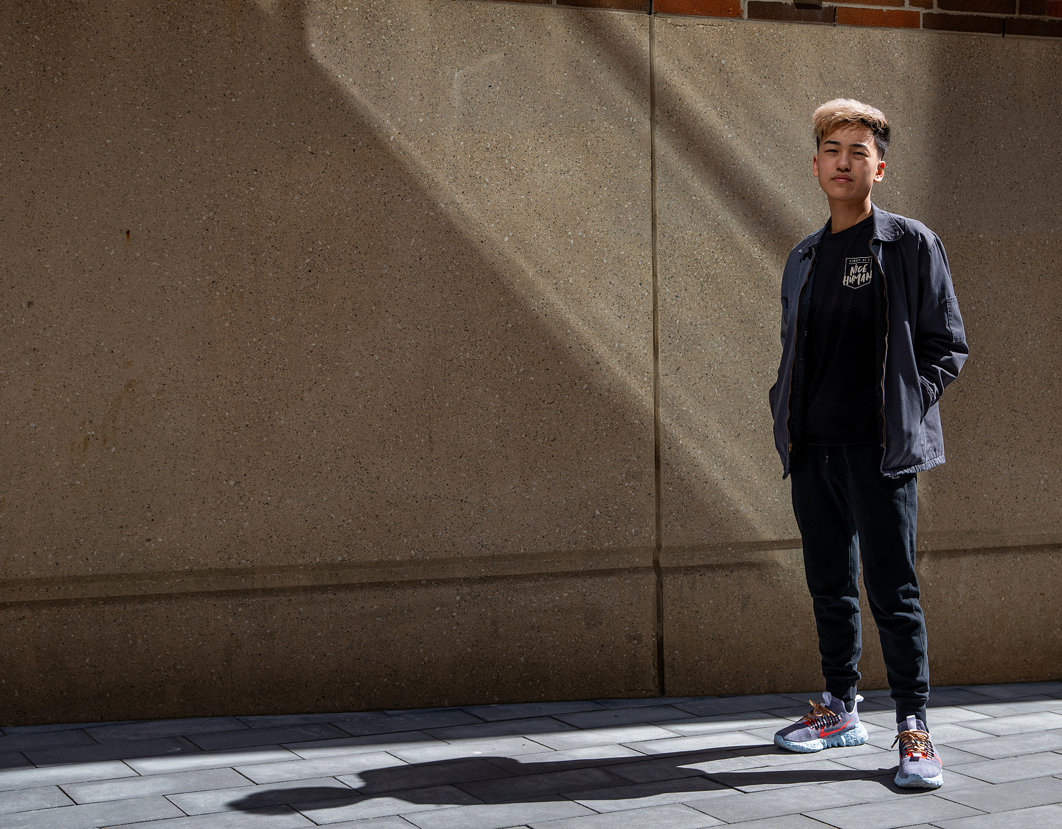 MSU sophomore Thomas Vue poses for a portrait outside of the MInskoff Pavilion on March 21, 2021. Thomas is proud of his Hmong heritage and has become a member of the Vietnamese Student Association at MSU.