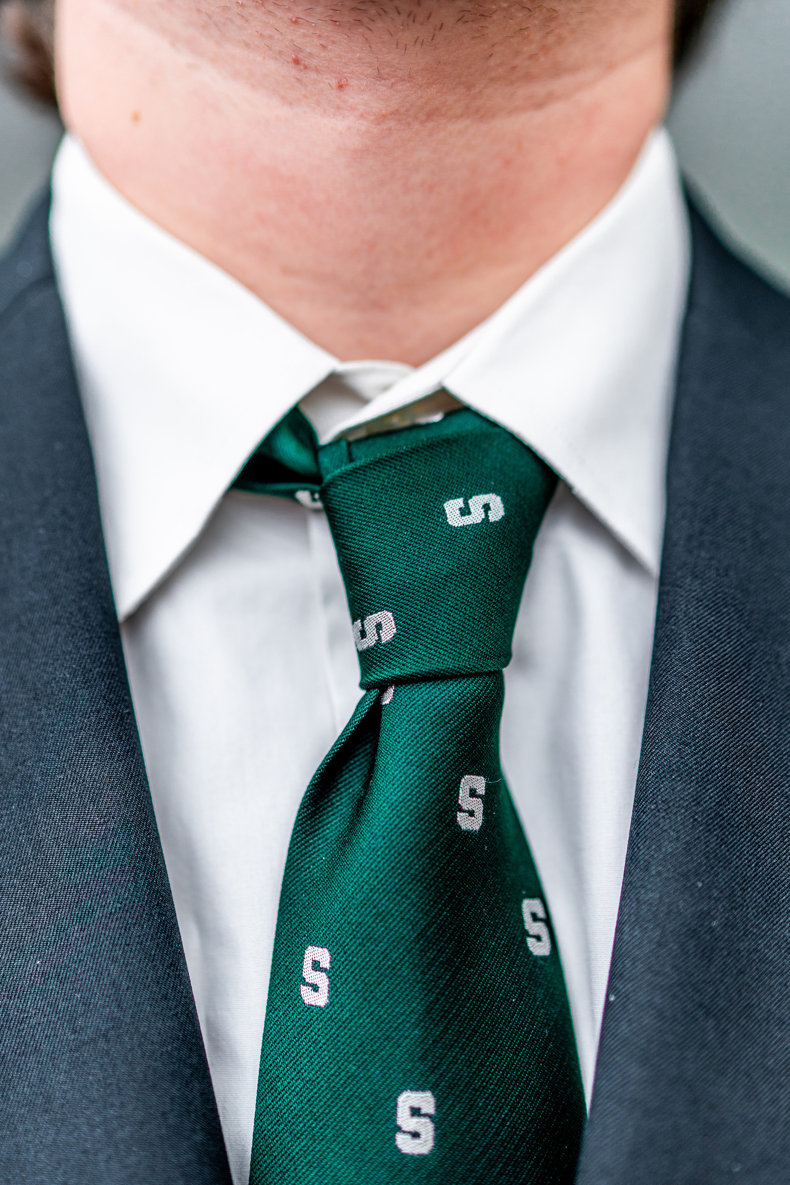 Alexander Hubbs, vice president of the Red Cedar Law Review wears a Spartan green tie during a debate on four topics between the Michigan State University Democrats and College Republicans at Broad Business College in East Lansing, Michigan on April 15, 2