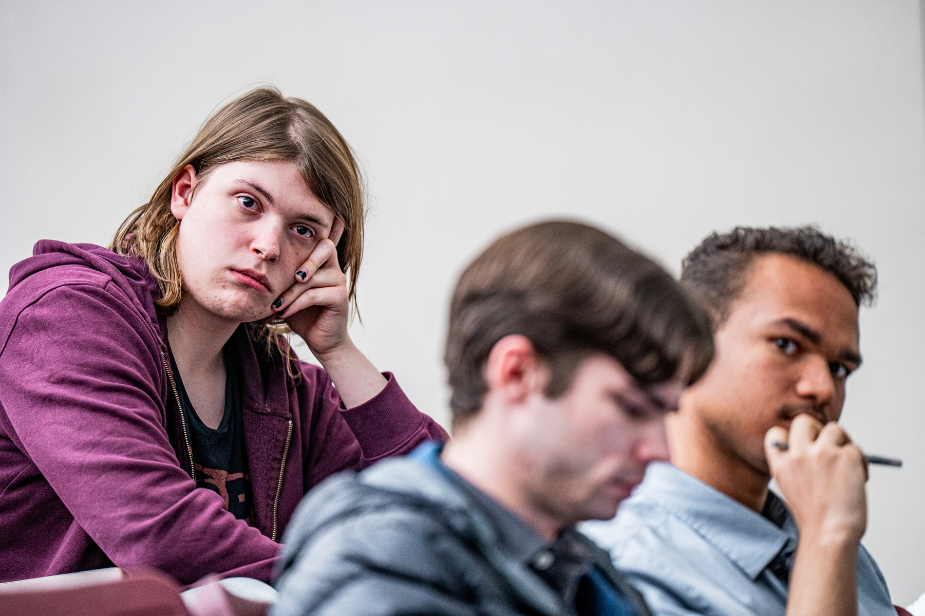 Members of the Michigan State University Democrats read to arguments made during a debate against the College Republicans at Broad Business College in East Lansing, Michigan on April 15, 2025.
